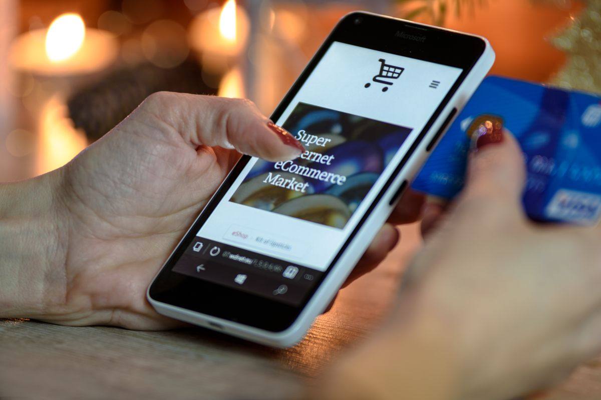 Customer paying online with a phone and bank card
